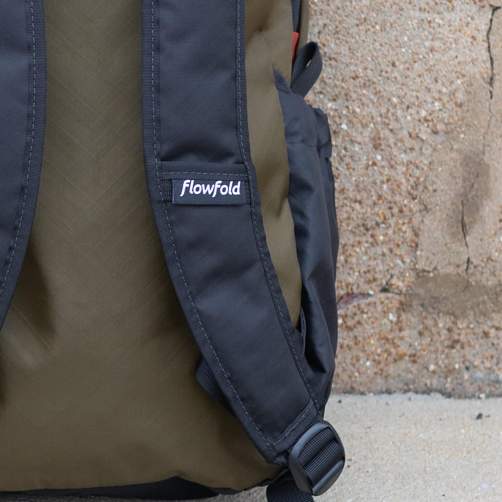 Olive Large Optimist Backpack 18L Flowfold. Lower strap view.