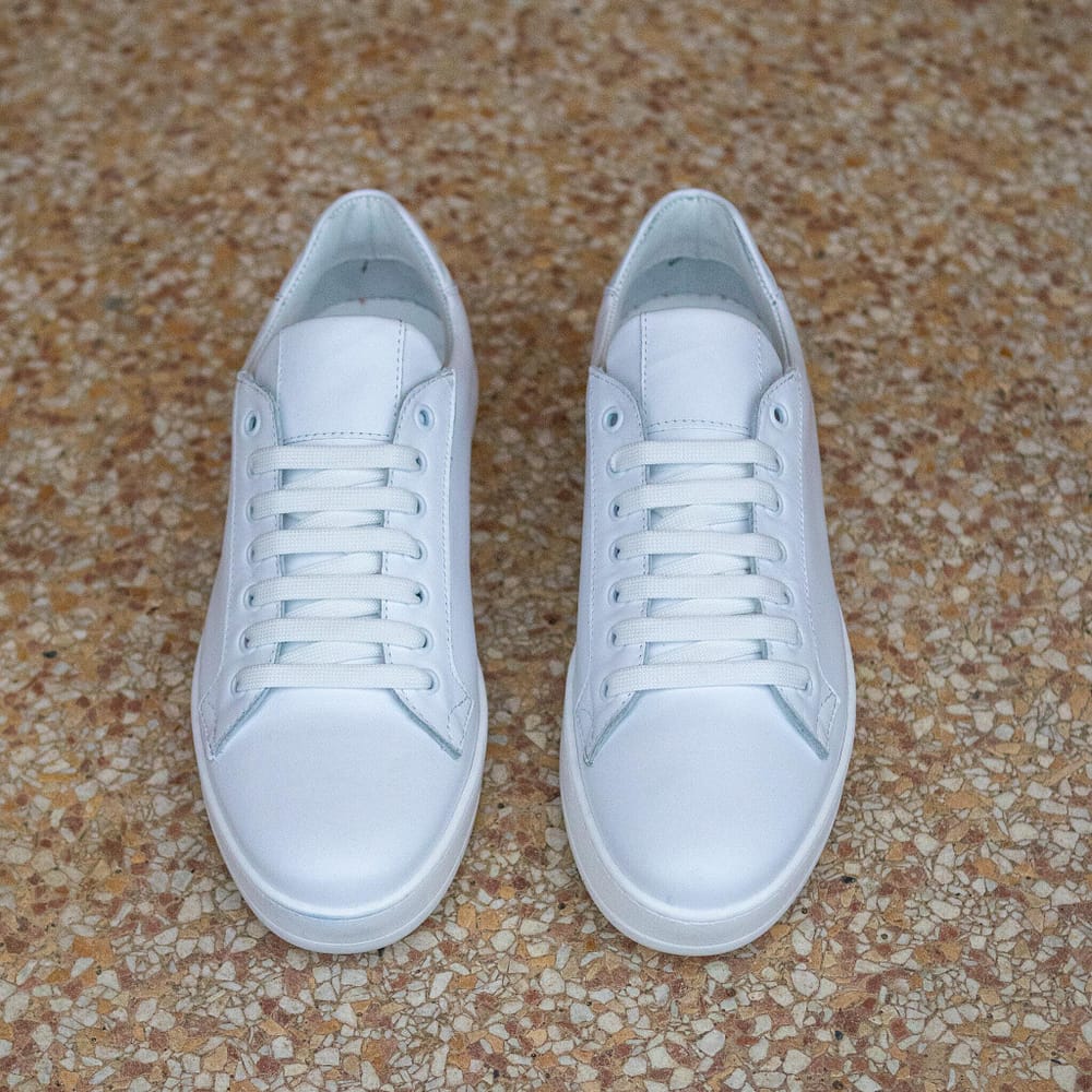 Classic White Calfskin Sneakers by British Passport. Front view.