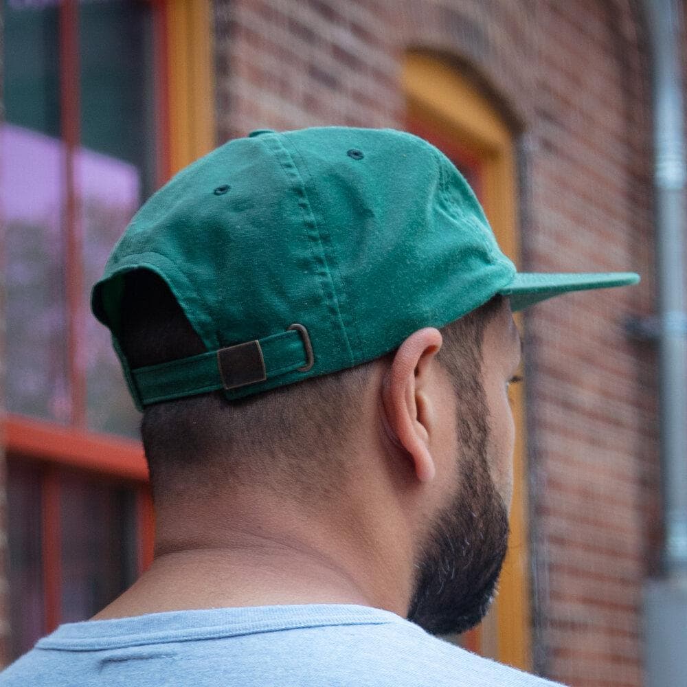 Leaf Wax Canvas Cap in Green by Ginew. Worn Back view.