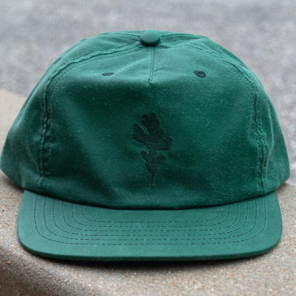Leaf Wax Canvas Cap in Green by Ginew. Genesis leaf embroidery view.