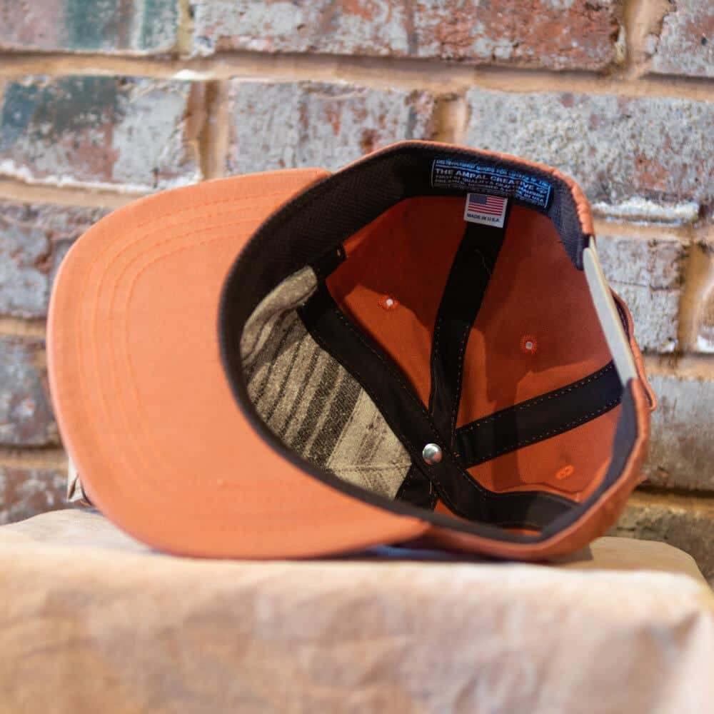 burnt orange by the Ampal Creative. Underside view.