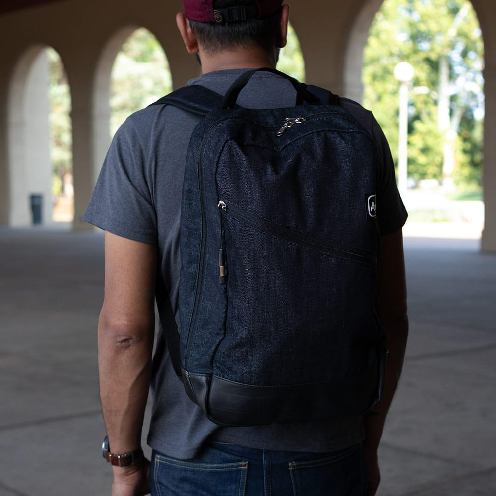 Fremont Recycled Denim Backpack by Alchemy Goods. Worn view.