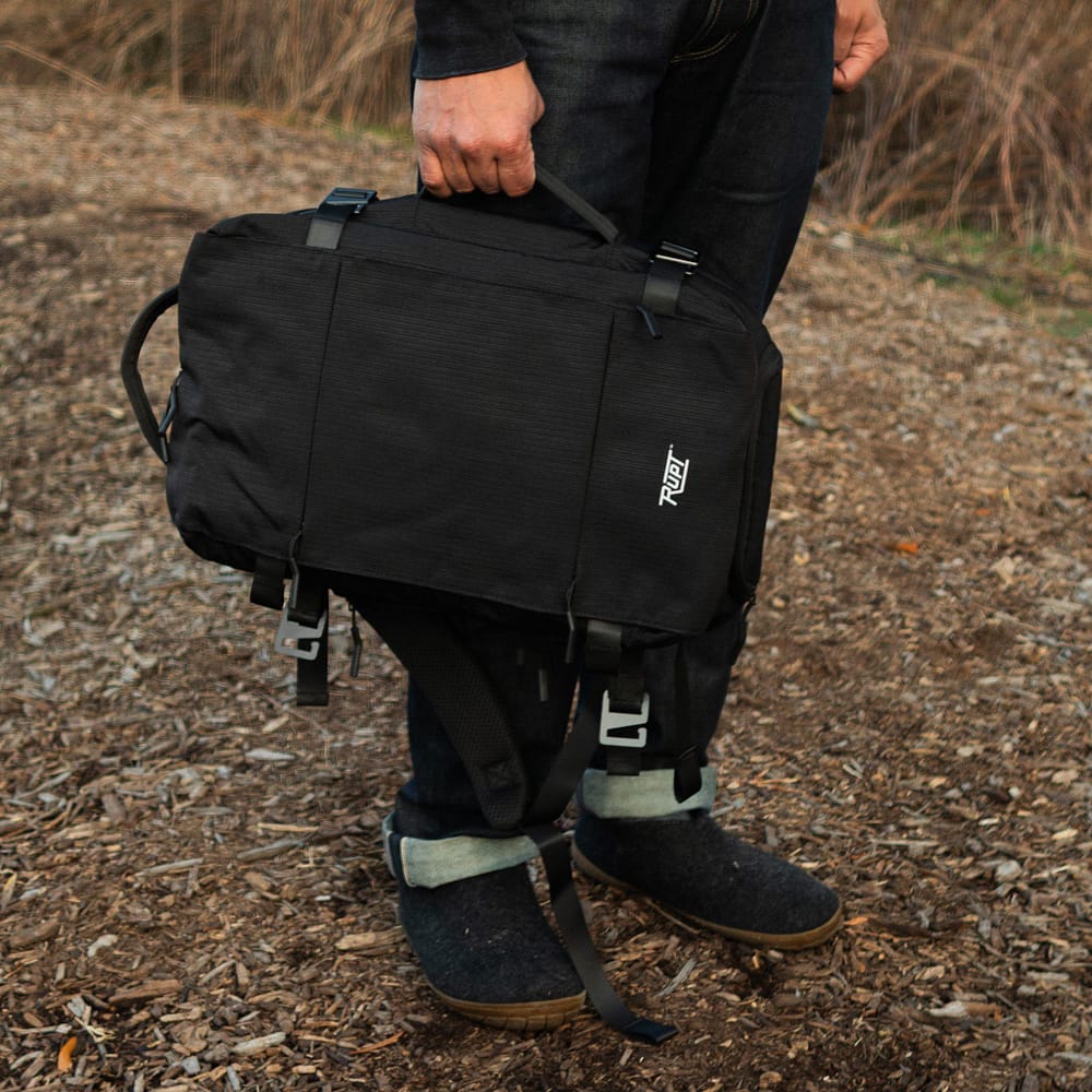 Skowell 18L Backpack by Rupt. Side carry handle in use view.